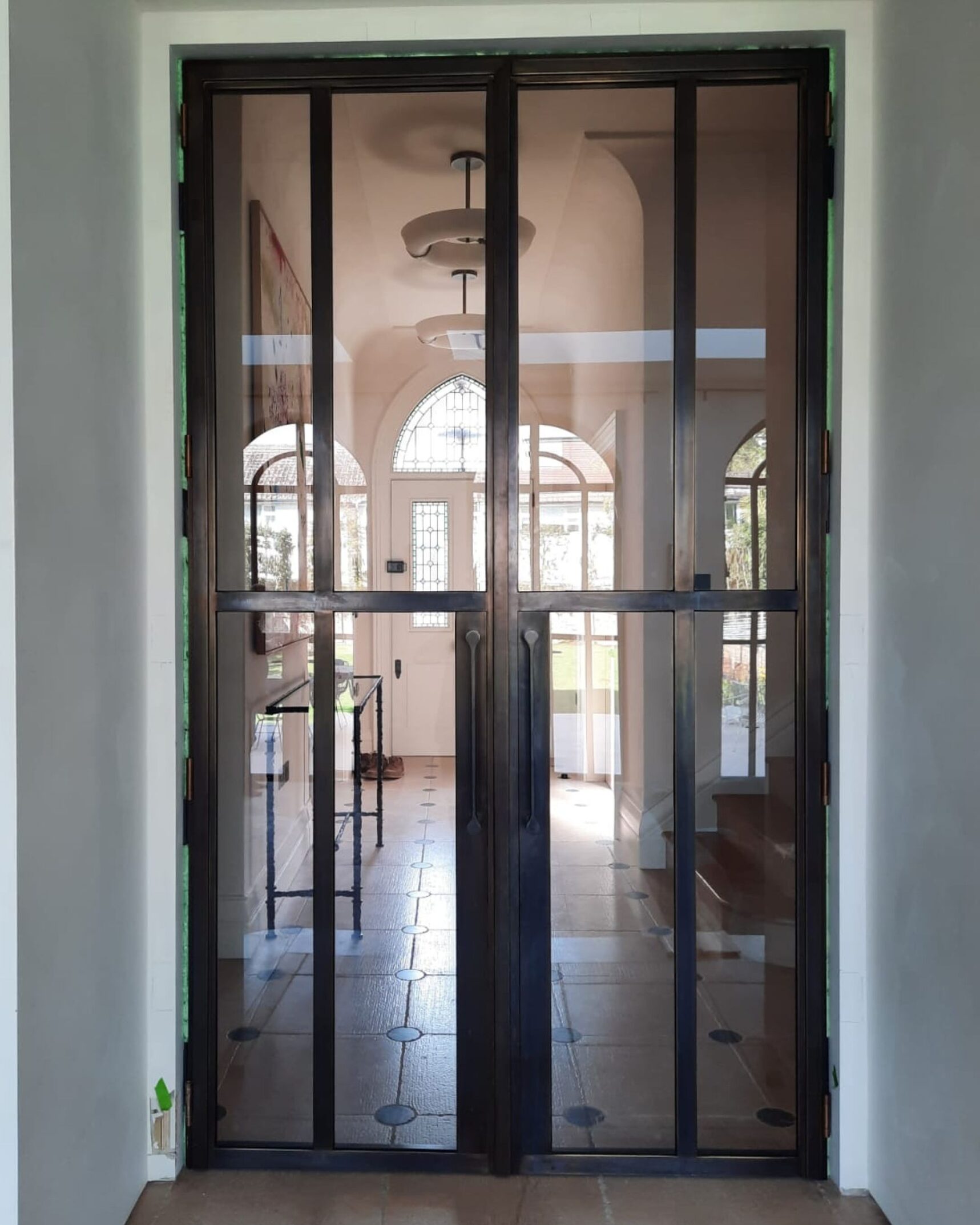 Internal bronze framed hinged glass door
