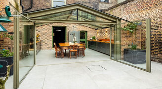 Beautiful rear glass extension with large pivot doors