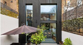 double height slot windows in black timber double height extension