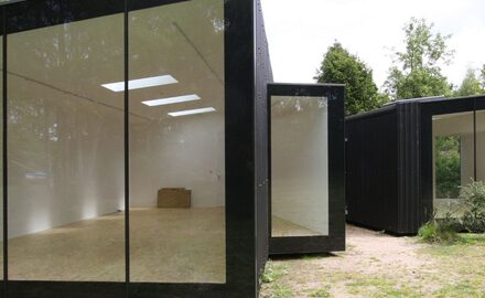Award winning garden studio with frameless structural glass