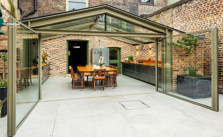 Beautiful rear glass extension with large pivot doors