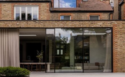 modern extension with floor to ceiling sliding glass doors
