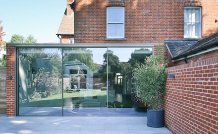 Glass side infill extension and glazed kitchen doors to Croft House