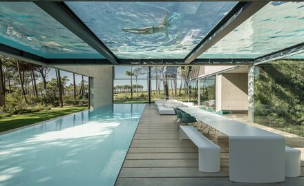 Frameless structural glass to create glazed internal swimming pool