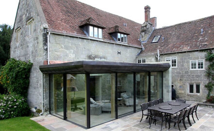 listed building with glass box extension