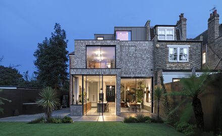 semi detached home with floor to ceiling glazing on the ground floor