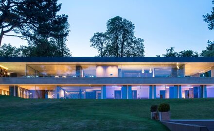 luxury villa in Switzerland with slim sliding glass doors and frameless glass balustrades