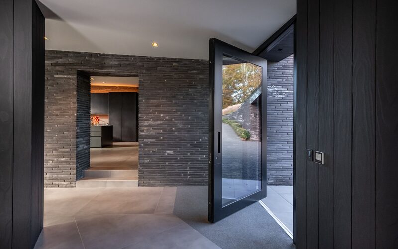 glass front door to a modern house