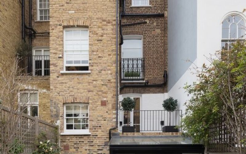 rear view on a listed London townhouse with a contemporary steel framed glass extension