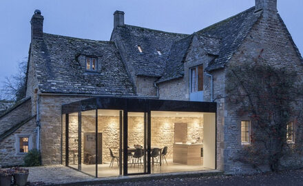 listed cottage with glass box extension